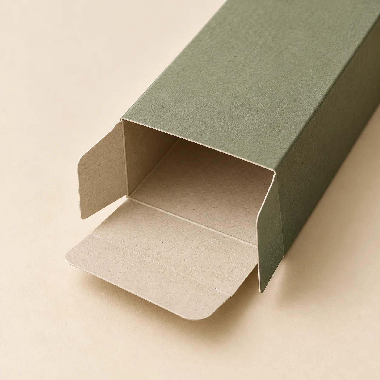 Close-up concept of a folding carton with a tactile recycled-board appearance.
