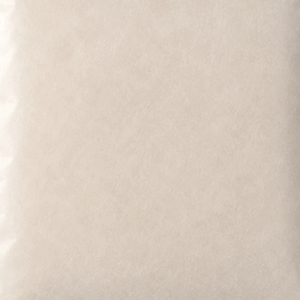 Close-up concept showing the natural fiber and translucency of glassine paper.